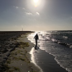 Mariannes silhouette på stranden
